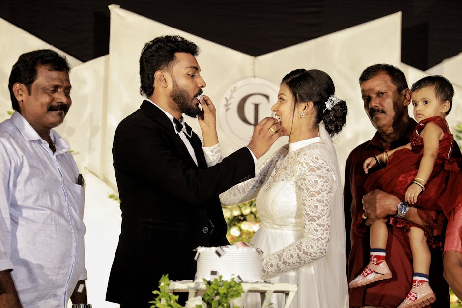 Elegant multi-tiered custom wedding cake with intricate royal icing details and floral decorations for Udaipur wedding