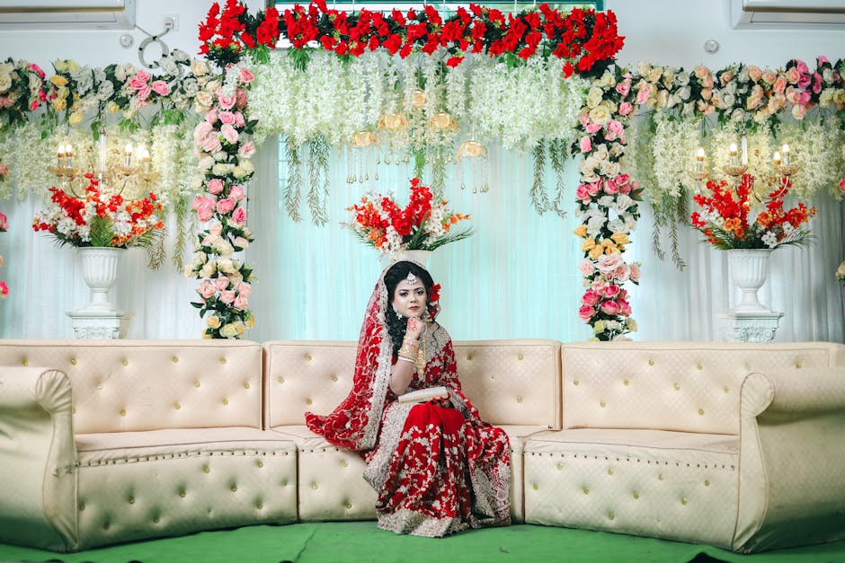 Elegant wedding floral arrangements with traditional marigolds and roses at a Udaipur palace venue