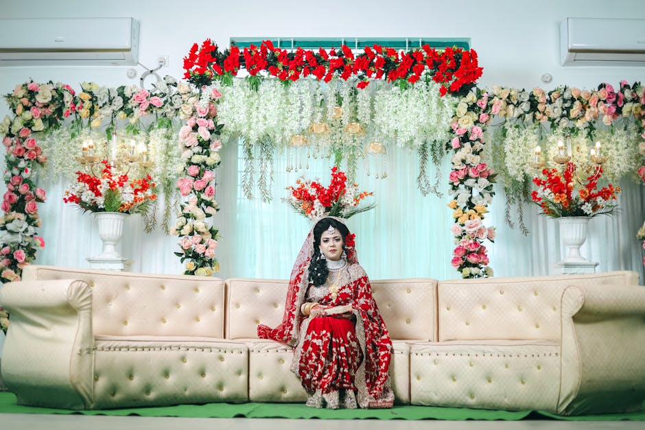 Luxury wedding decor setup at a palace venue in Udaipur with elaborate floral arrangements