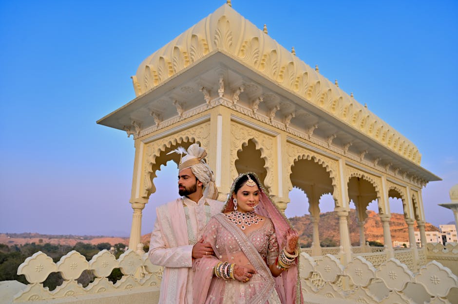 Romantic pre-wedding photography session at a historic location in Udaipur with couple in traditional attire