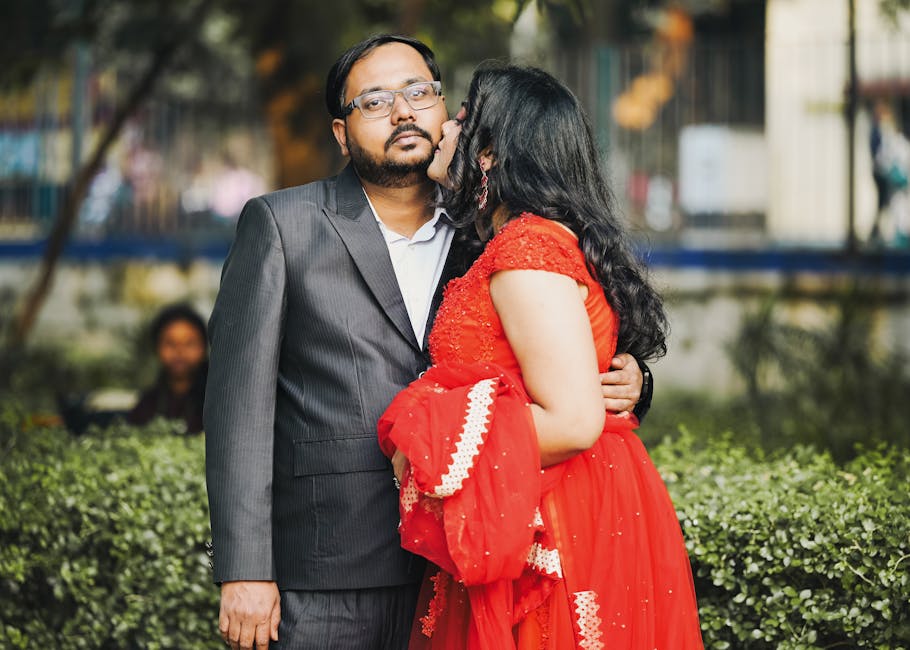 Couple posing for pre-wedding photoshoot at scenic Udaipur lakeside location during golden hour