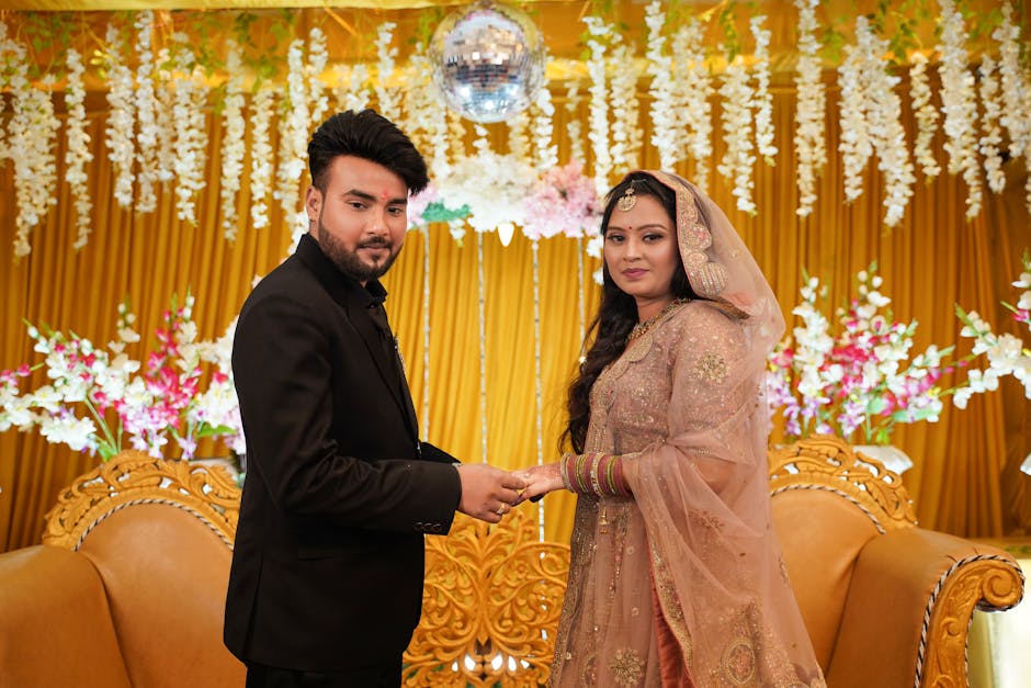 Professional wedding photography setup with equipment capturing bride and groom portraits at Udaipur palace venue